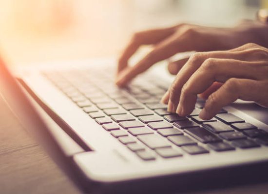 Hands on a keyboard.