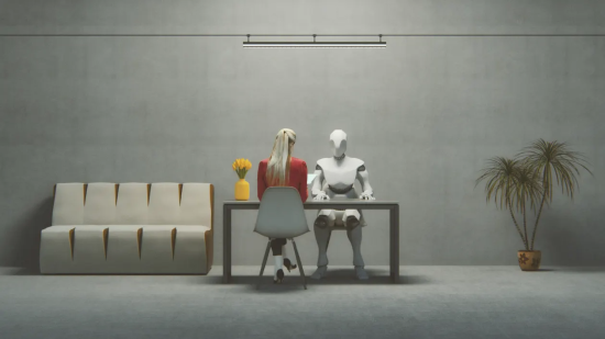 Human and robot sitting across table indoors.
