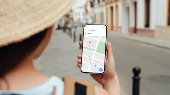 Person using smartphone with navigation map.