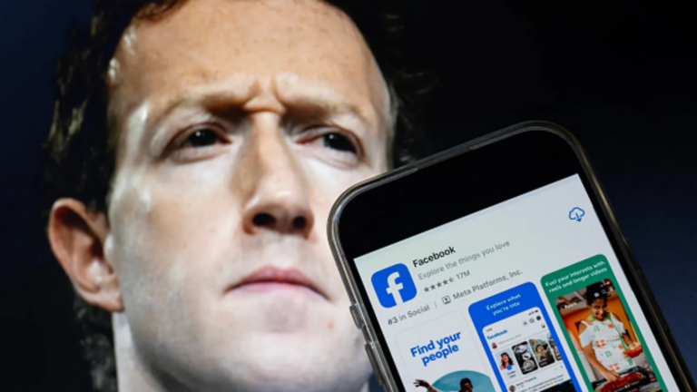 Phone showing Facebook app download screen in front of Mark Zuckerberg.