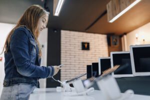 girl looking at laptops